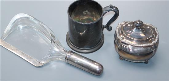 An unusual silver mounted glass crumb scoop, a Victorian silver tea caddy and a Victorian silver mug.